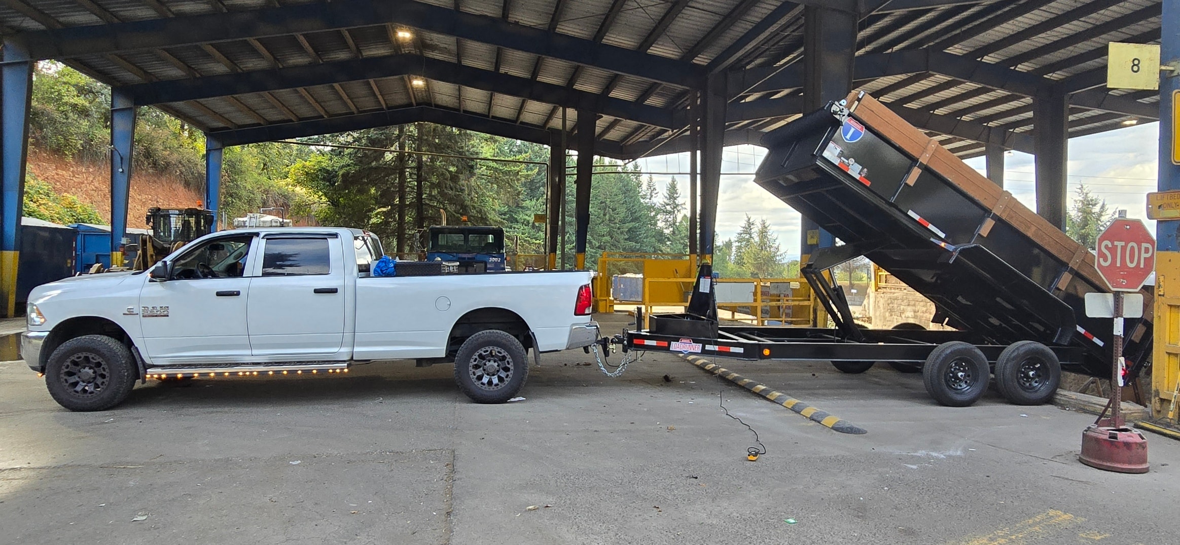 Waste Slayer Hauling truck and dump trailer at transfer station — Pacific Northwest junk removal